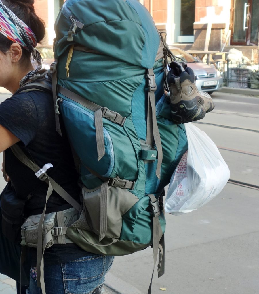 carrying a backpack and demonstrating how I wrapped up the hiking boot my roommate pissed in while I was on the Trans-Mongolian railroad