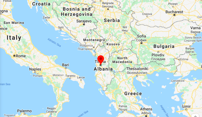 a map of the world with Tirana, Albania pinned